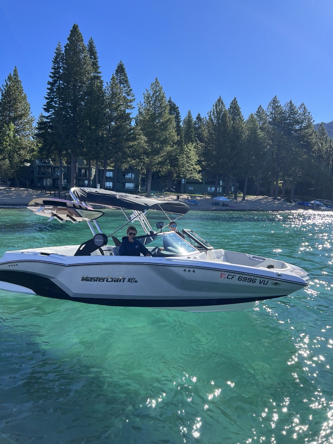 Boxcar Surf boat on clear Lake Tahoe water