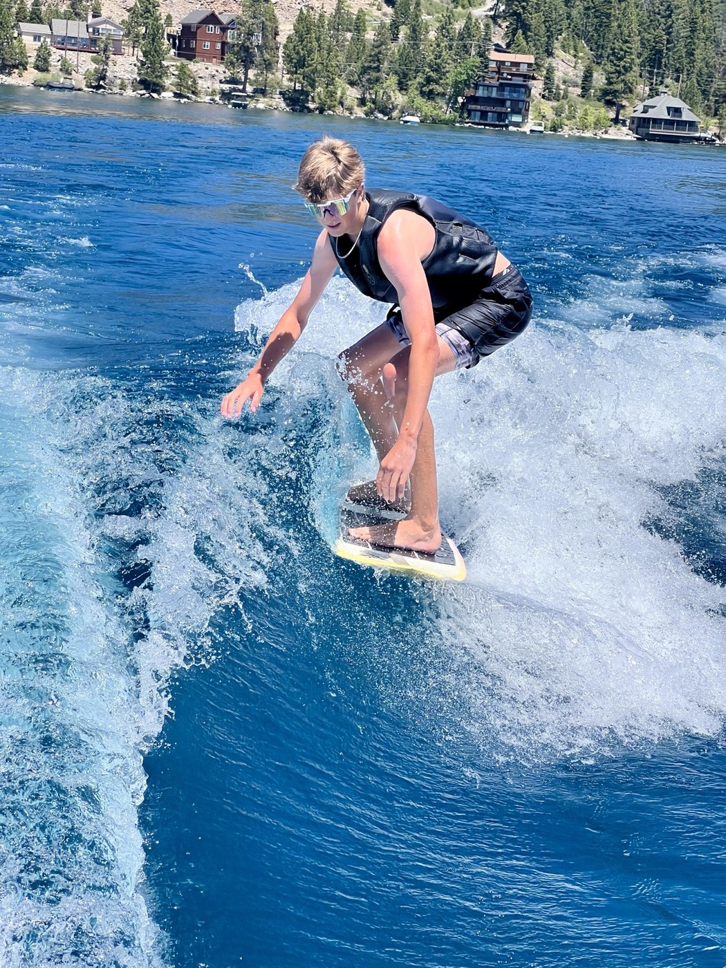 Wake surfing behind the boat